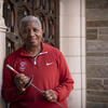 Temple University fencing coach Nikki Franke wearing a cherry red pull over