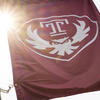 The cherry red Temple flag on Main Campus