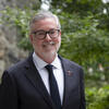 A professional headshot of President John Fry